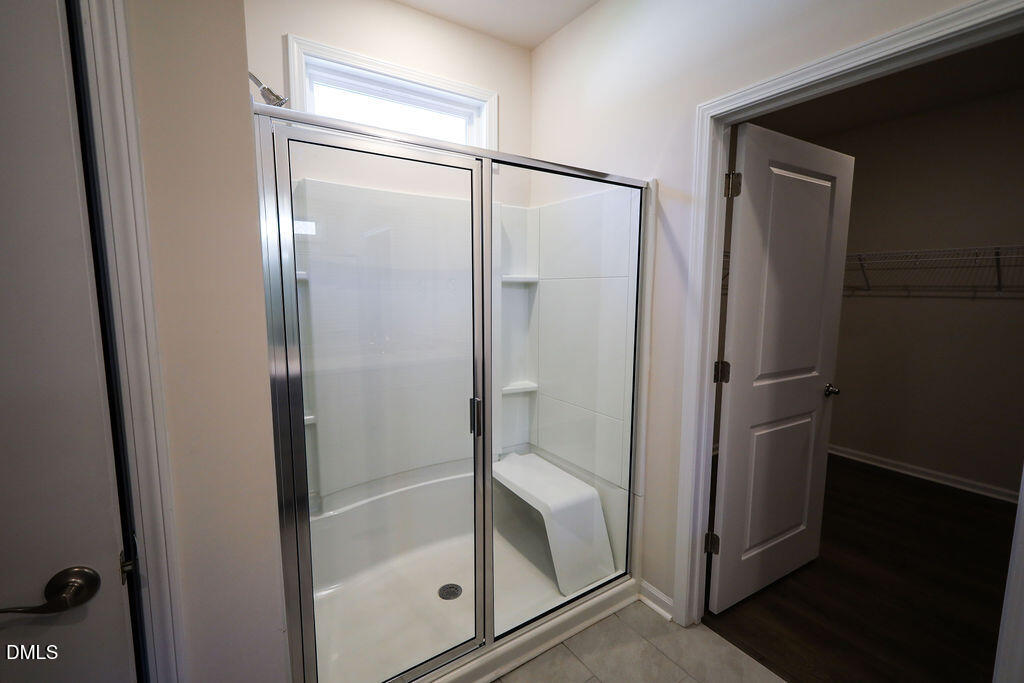1644 Abberly Place Graham, NC 27253 - Photo 22 of 33 a bathroom with a glass shower door