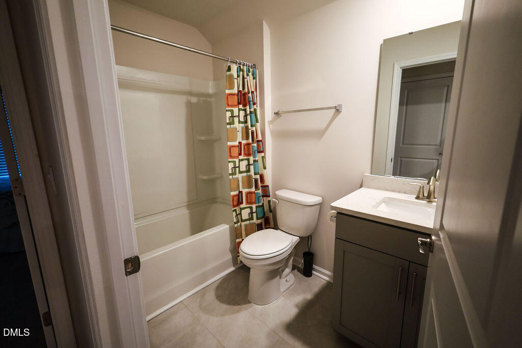1644 Abberly Place Graham, NC 27253 - Photo 28 of 33 a bathroom with a sink toilet and shower
