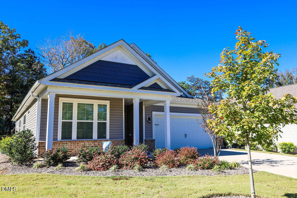 1644 Abberly Place Graham, NC 27253 - Photo 3 of 33 a front view of a house with garden