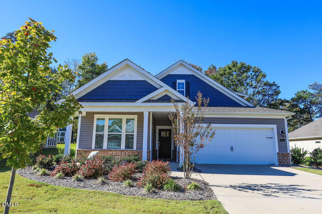 1644 Abberly Place Graham, NC 27253 - Photo 4 of 33 a front view of a house with garden