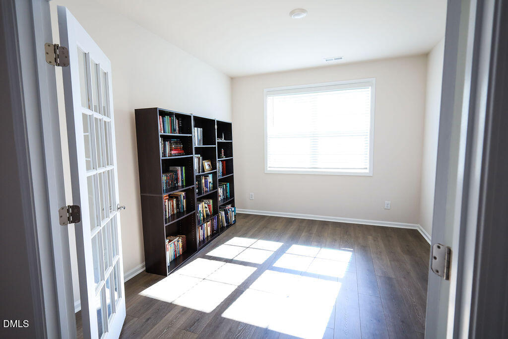 1644 Abberly Place Graham, NC 27253 - Photo 8 of 33 a view of walk in closet with clothes and shoes