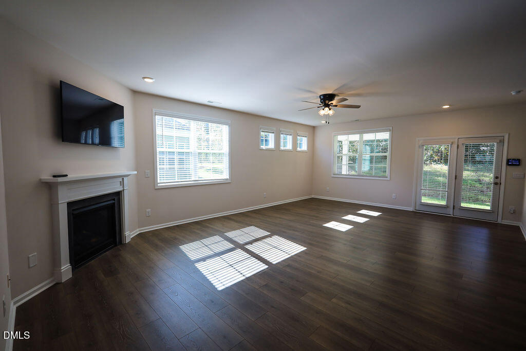 1644 Abberly Place Graham, NC 27253 - Photo 10 of 33 a view of an empty room with wooden floor and a window