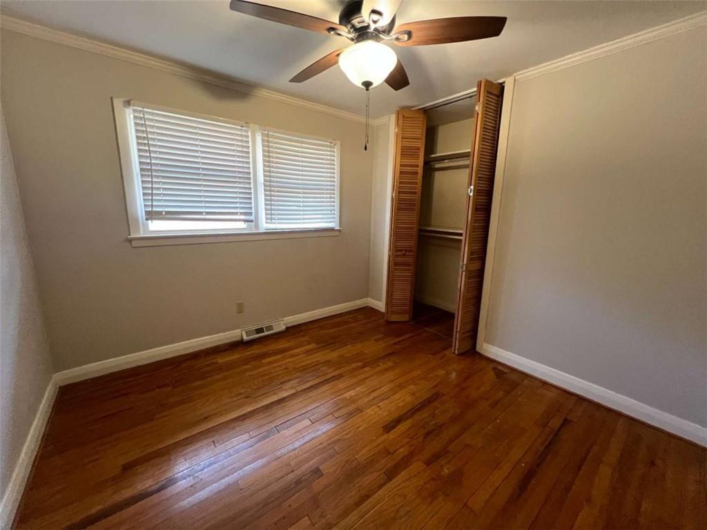 109 Chief Vann Drive Southwest Rome, GA 30165 - Photo 12 of 15 a view of an empty room with wooden floor and a window