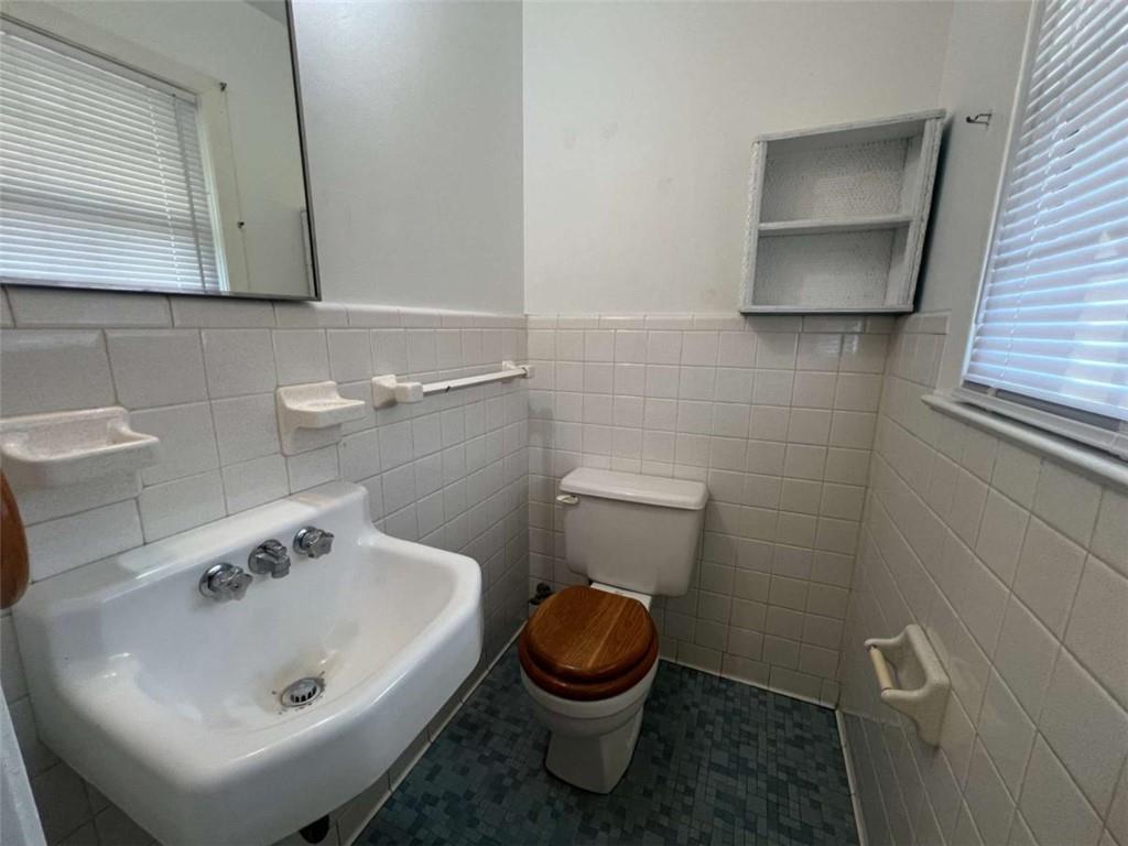 109 Chief Vann Drive Southwest Rome, GA 30165 - Photo 14 of 15 a bathroom with a sink a toilet and mirror