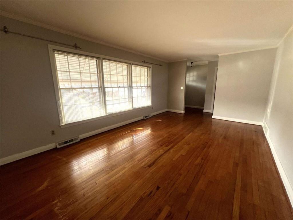 109 Chief Vann Drive Southwest Rome, GA 30165 - Photo 2 of 15 a view of an empty room with wooden floor and a window