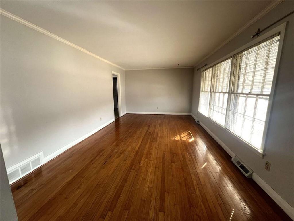 109 Chief Vann Drive Southwest Rome, GA 30165 - Photo 3 of 15 a view of empty room with wooden floor and fan
