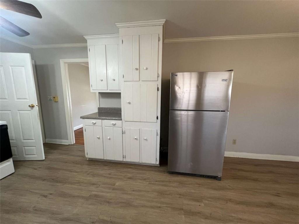109 Chief Vann Drive Southwest Rome, GA 30165 - Photo 5 of 15 a kitchen with stainless steel appliances a refrigerator and a stove top oven