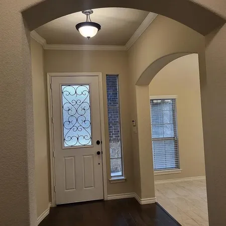 a view of an empty room with a window
