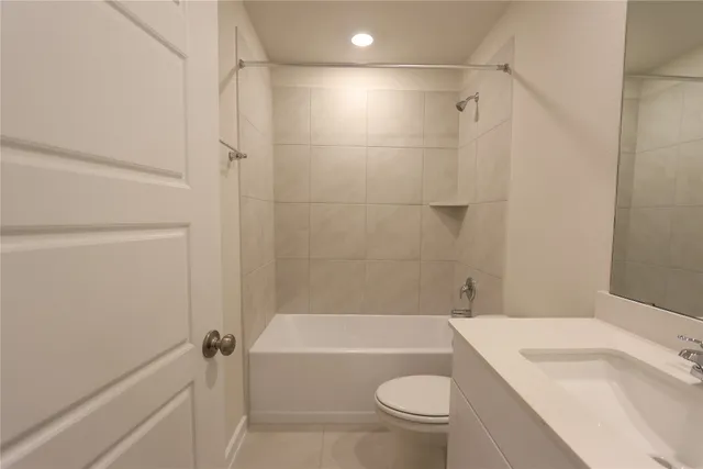 a bathroom with a sink a toilet and a bathtub
