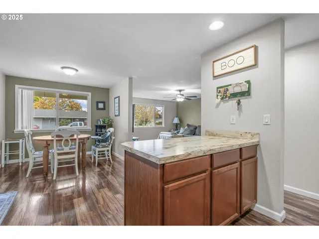 a kitchen with a table and chairs