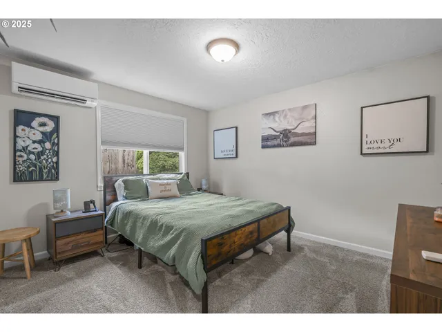 a bedroom with a bed and a table