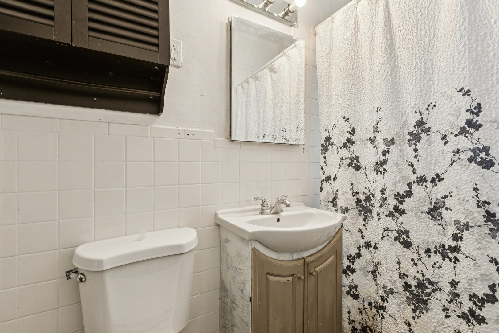 2115 Emerson Street Evanston, IL 60201 - Photo 13 of 37 a bathroom with a sink and a toilet