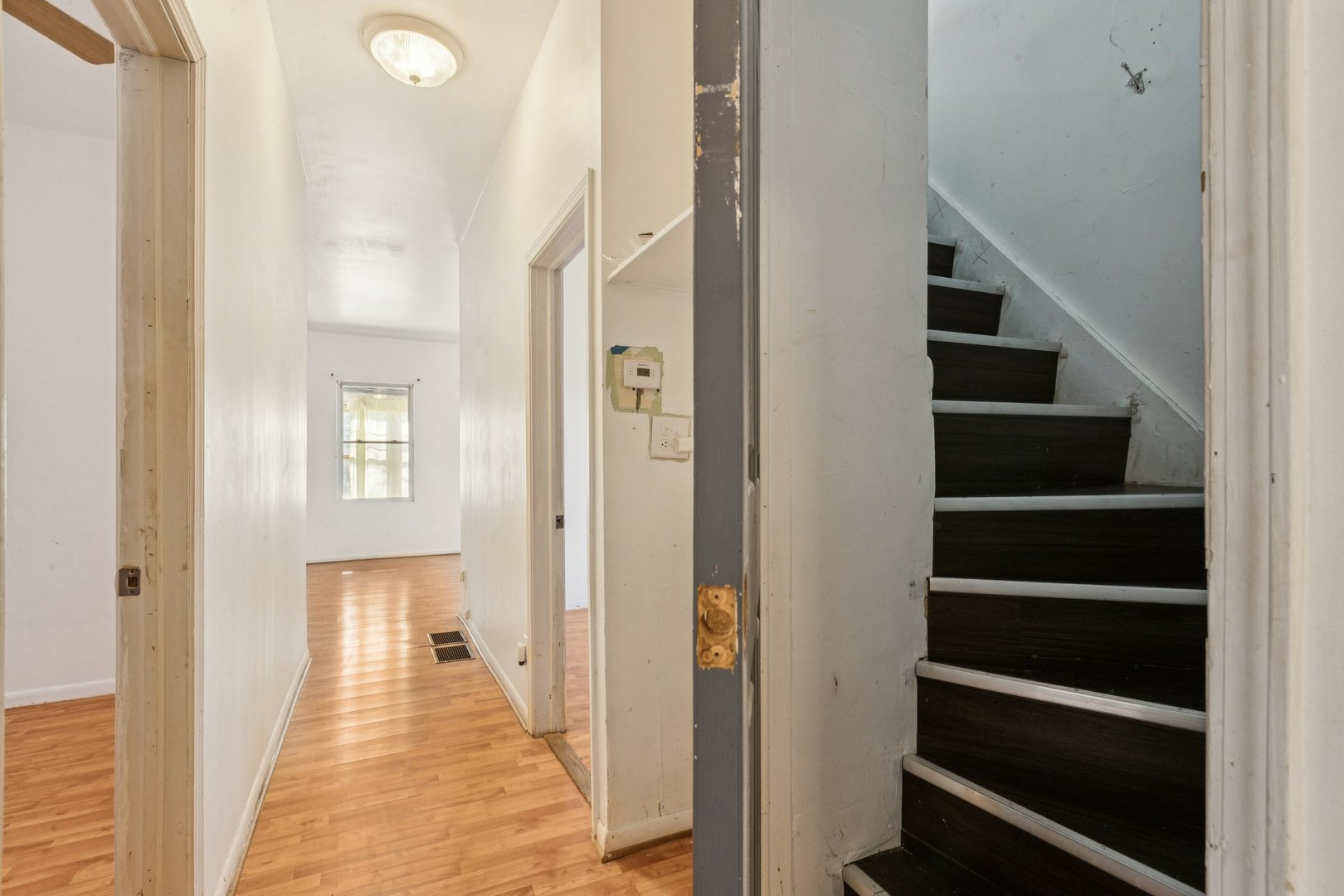2115 Emerson Street Evanston, IL 60201 - Photo 14 of 37 a view of a hallway with wooden floor and entryway
