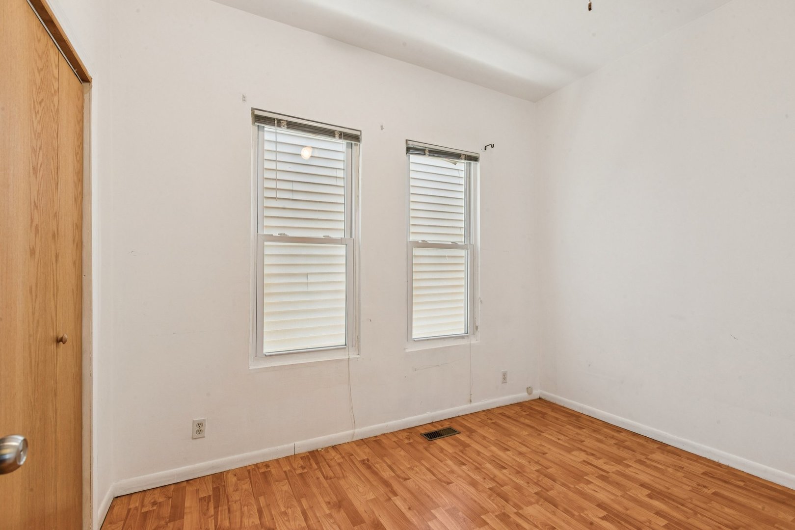 2115 Emerson Street Evanston, IL 60201 - Photo 15 of 37 a view of an empty room with wooden floor and a window