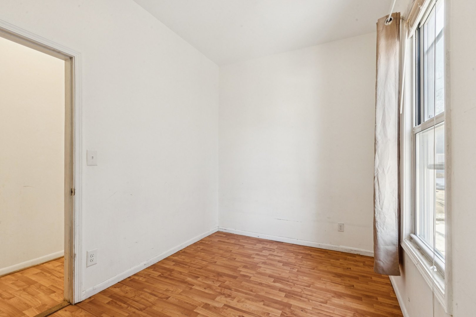 2115 Emerson Street Evanston, IL 60201 - Photo 17 of 37 a view of a room with wooden floor and a window