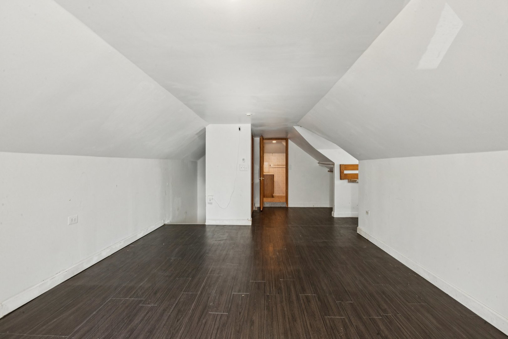 2115 Emerson Street Evanston, IL 60201 - Photo 21 of 37 a view of an empty room with wooden floor