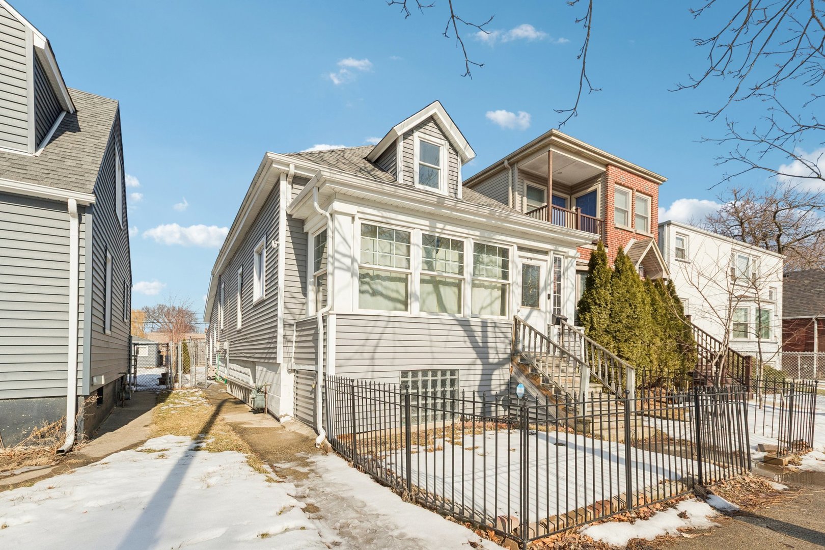 2115 Emerson Street Evanston, IL 60201 - Photo 3 of 37 a view of a brick house with large windows