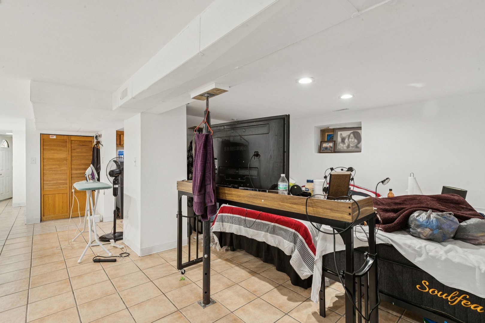 2115 Emerson Street Evanston, IL 60201 - Photo 31 of 37 a bedroom with furniture and a lamp