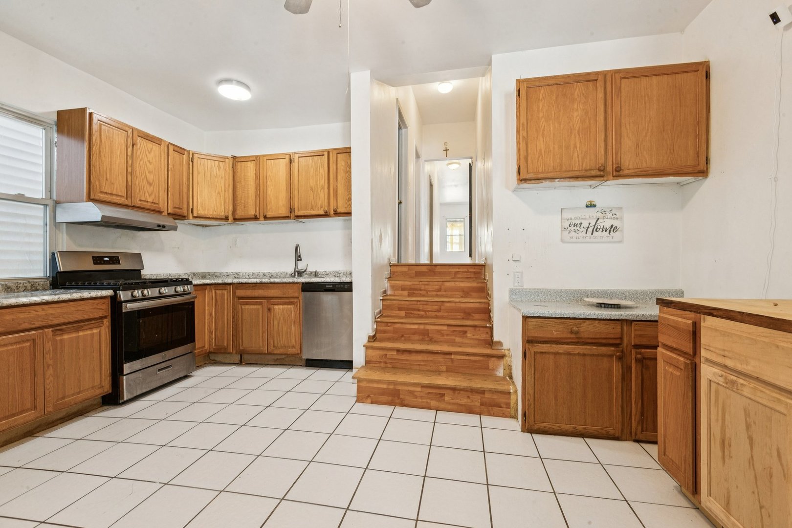 2115 Emerson Street Evanston, IL 60201 - Photo 6 of 37 a kitchen with stainless steel appliances granite countertop a stove a sink and a refrigerator