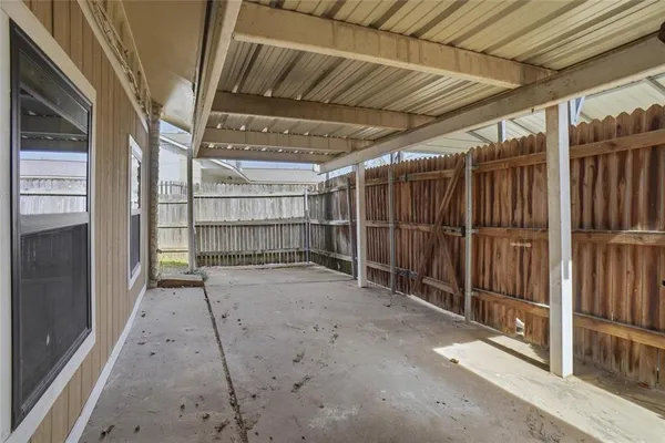 a view of an empty room with wooden walls