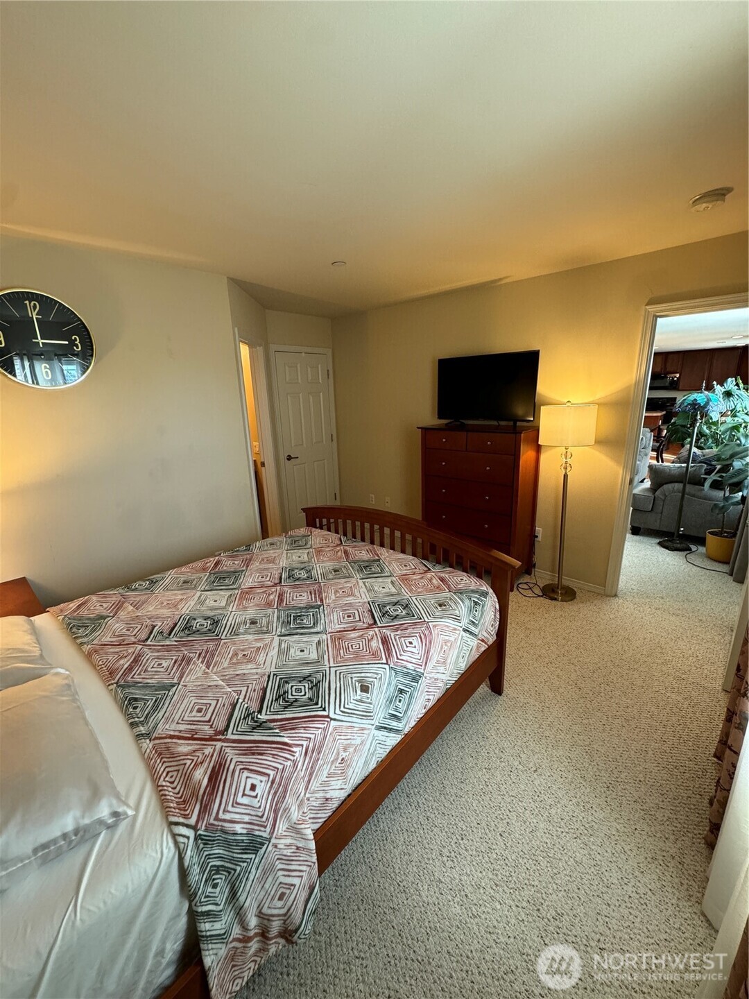 1175 Swan Loop DuPont, WA 98327 - Photo 13 of 34 a bed sitting in a bedroom and lamp