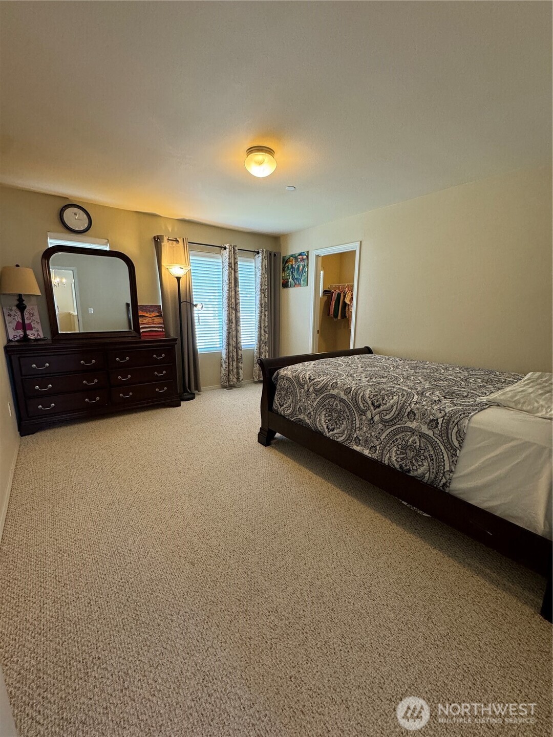 1175 Swan Loop DuPont, WA 98327 - Photo 16 of 34 a bedroom with a bed lamp and a dresser