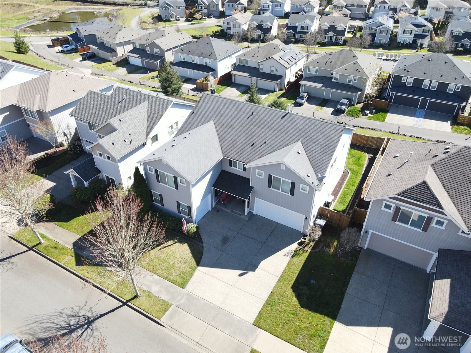 1175 Swan Loop DuPont, WA 98327 - Photo 32 of 34 an aerial view of a residential houses with yard