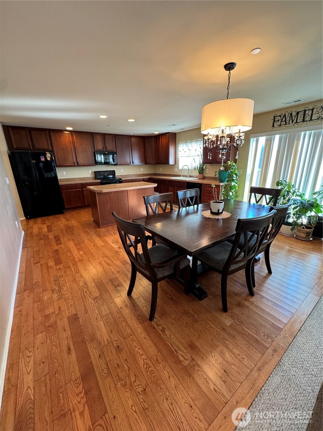 1175 Swan Loop DuPont, WA 98327 - Photo 5 of 34 a view of a dining room with furniture and wooden floor
