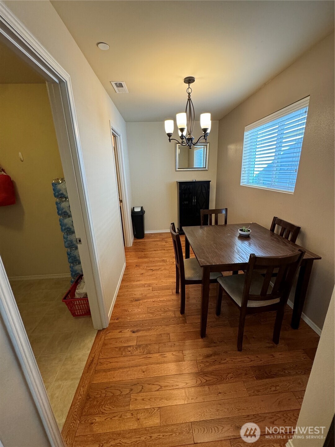 1175 Swan Loop DuPont, WA 98327 - Photo 7 of 34 a view of a dining room with furniture and a chandelier