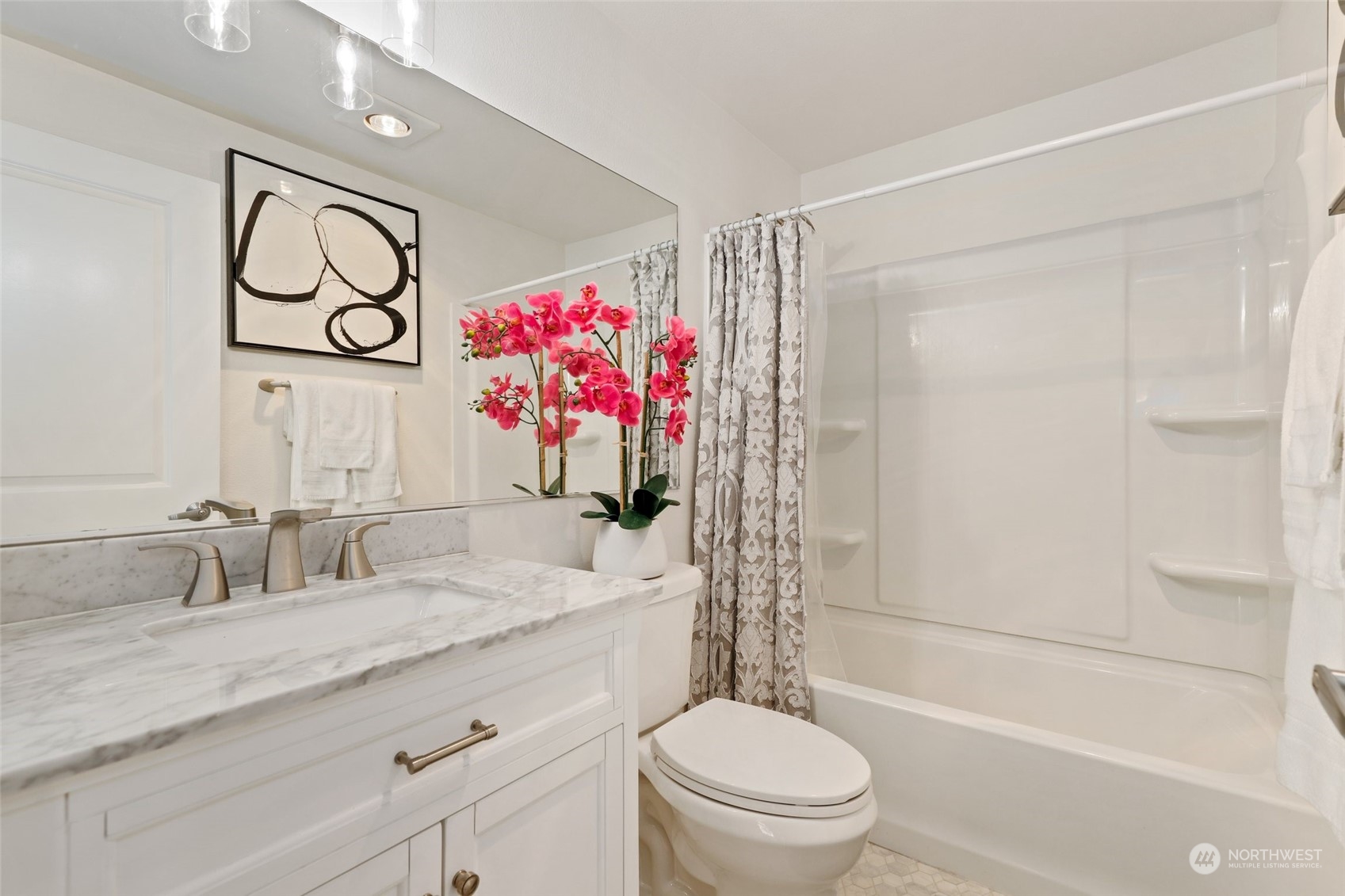 12404 East Gibson Road, Unit J103 Everett, WA 98204 - Photo 23 of 40 a bathroom with a granite countertop sink mirror vanity and toilet