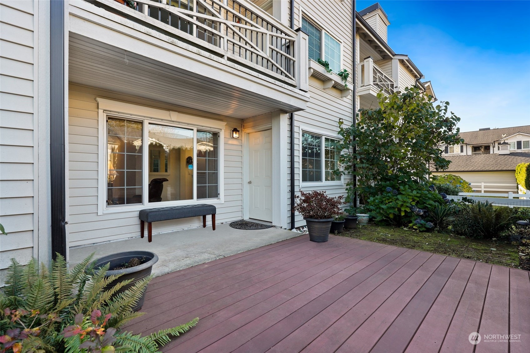 12404 East Gibson Road, Unit J103 Everett, WA 98204 - Photo 26 of 40 a view of a house with backyard and sitting area