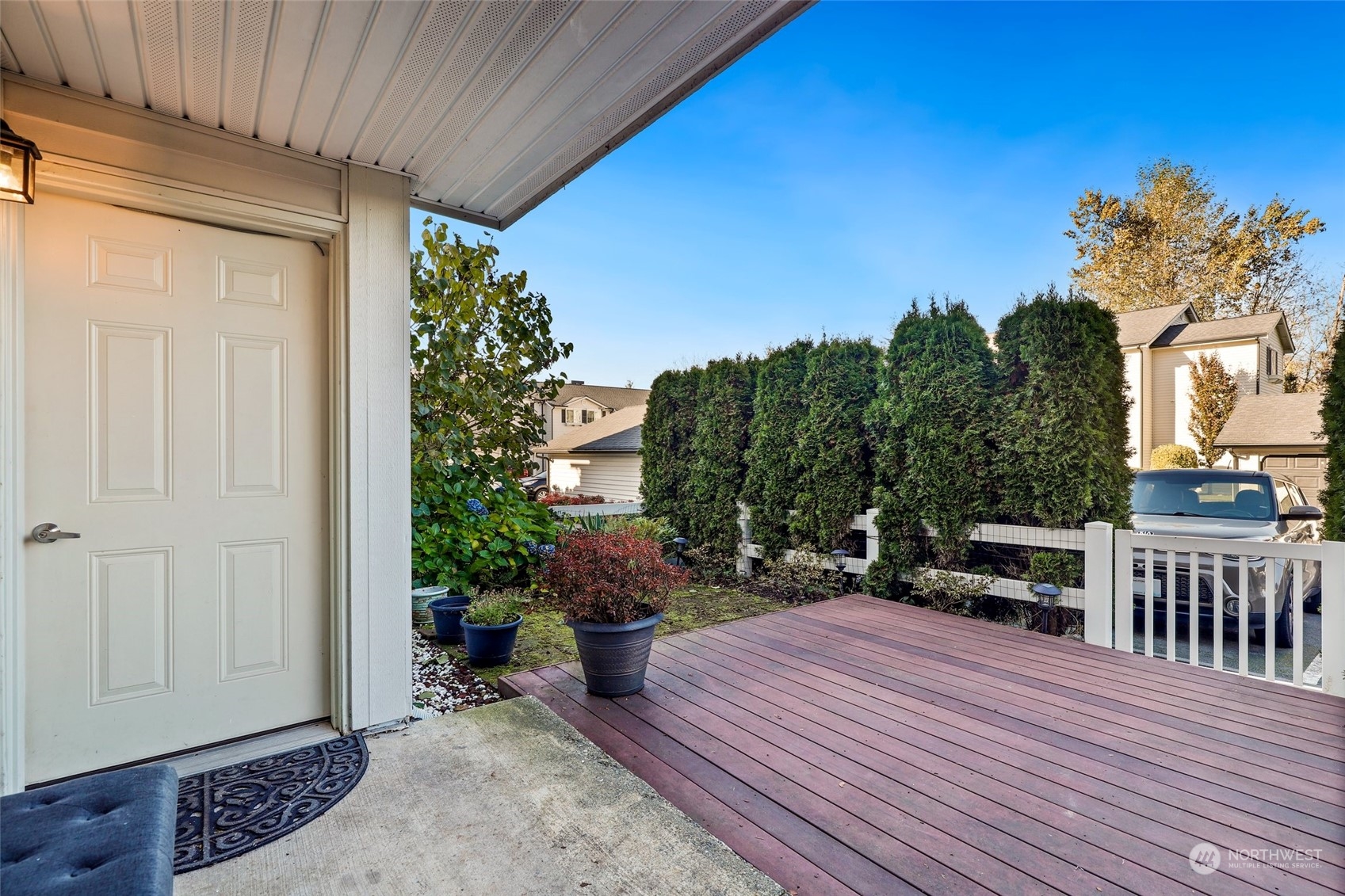 12404 East Gibson Road, Unit J103 Everett, WA 98204 - Photo 28 of 40 a balcony with wooden floor table and chairs