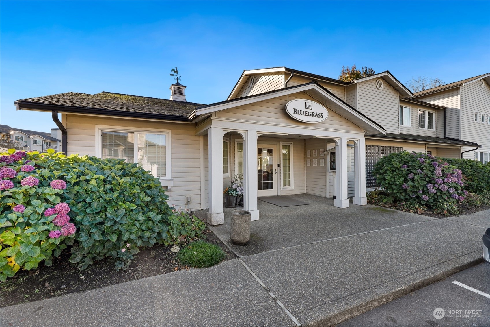 12404 East Gibson Road, Unit J103 Everett, WA 98204 - Photo 34 of 40 a front view of a house with a yard