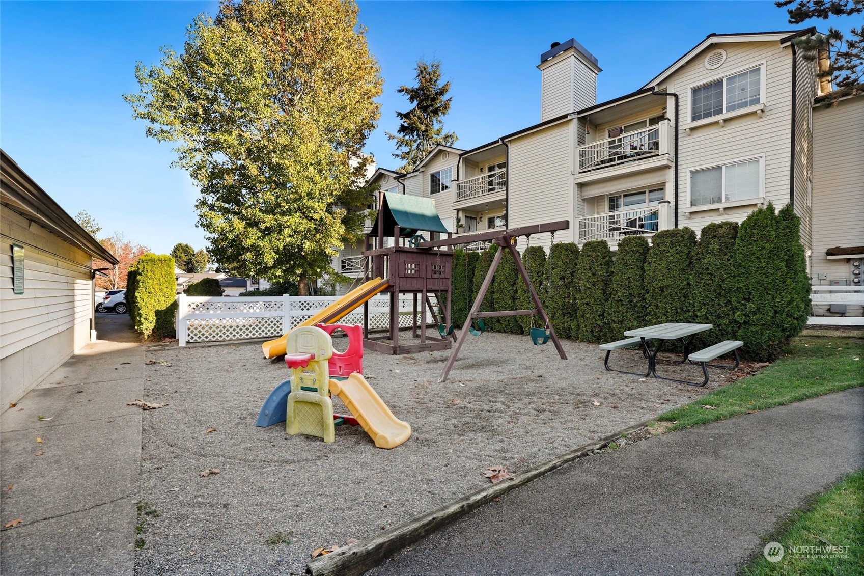 12404 East Gibson Road, Unit J103 Everett, WA 98204 - Photo 38 of 40 a view of outdoor space with playground and green space