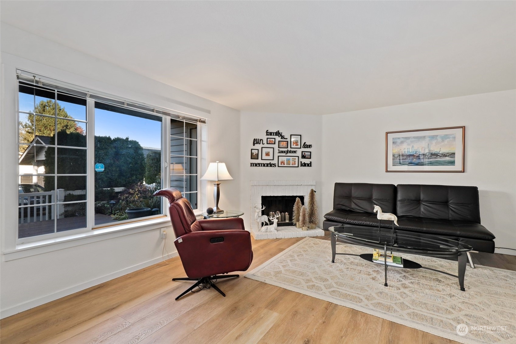 12404 East Gibson Road, Unit J103 Everett, WA 98204 - Photo 6 of 40 a living room with furniture and a fireplace
