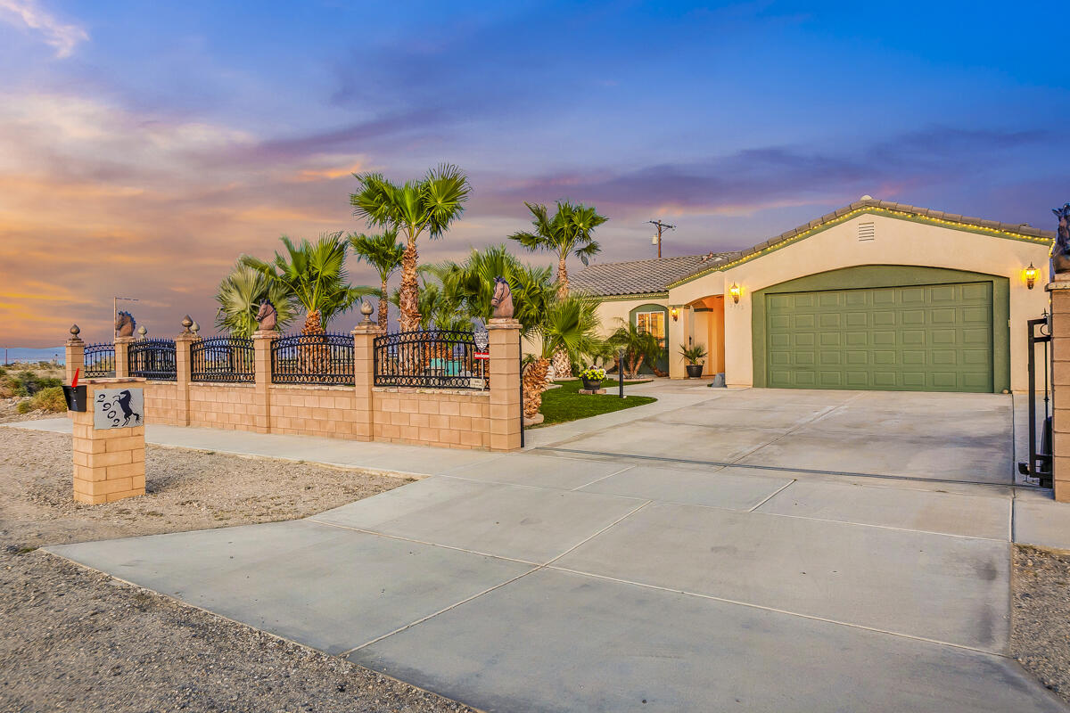 2902 Treadwell Boulevard Thermal, CA 92274 - Photo 12 of 88 a front view of a house with a yard