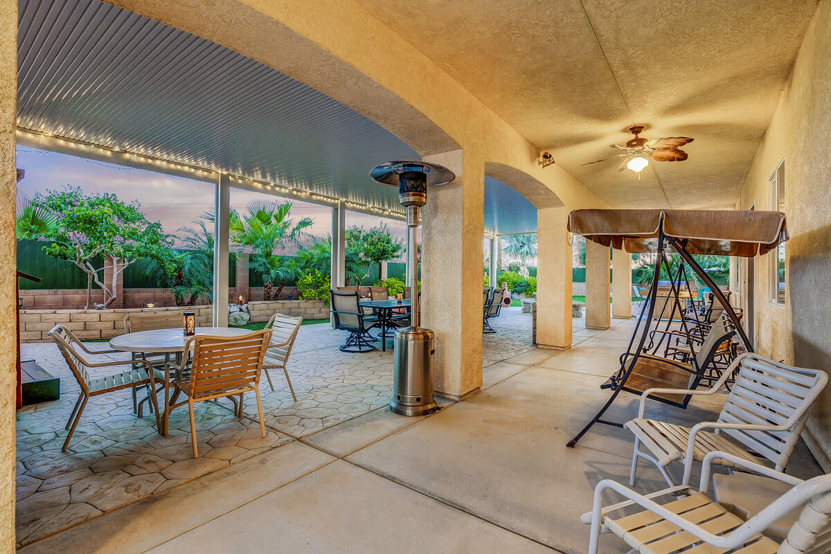 2902 Treadwell Boulevard Thermal, CA 92274 - Photo 15 of 88 a view of a patio with a dining table and chairs