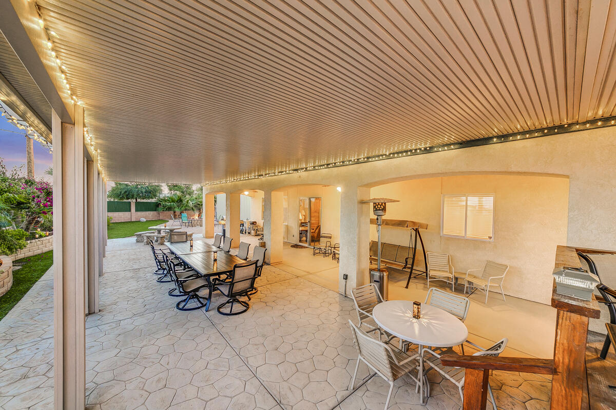2902 Treadwell Boulevard Thermal, CA 92274 - Photo 22 of 88 a view of a patio with table and chairs next to a yard