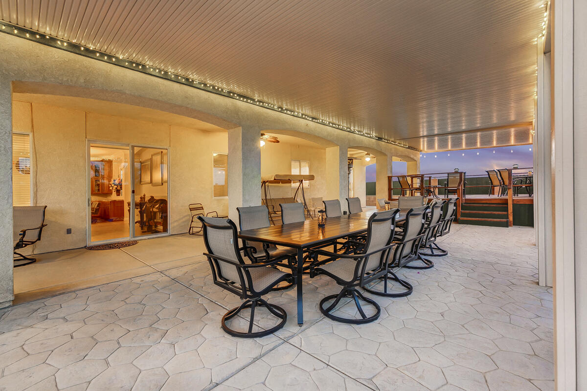 2902 Treadwell Boulevard Thermal, CA 92274 - Photo 23 of 88 a view of a dining room and livingroom with furniture wooden floor and a rug