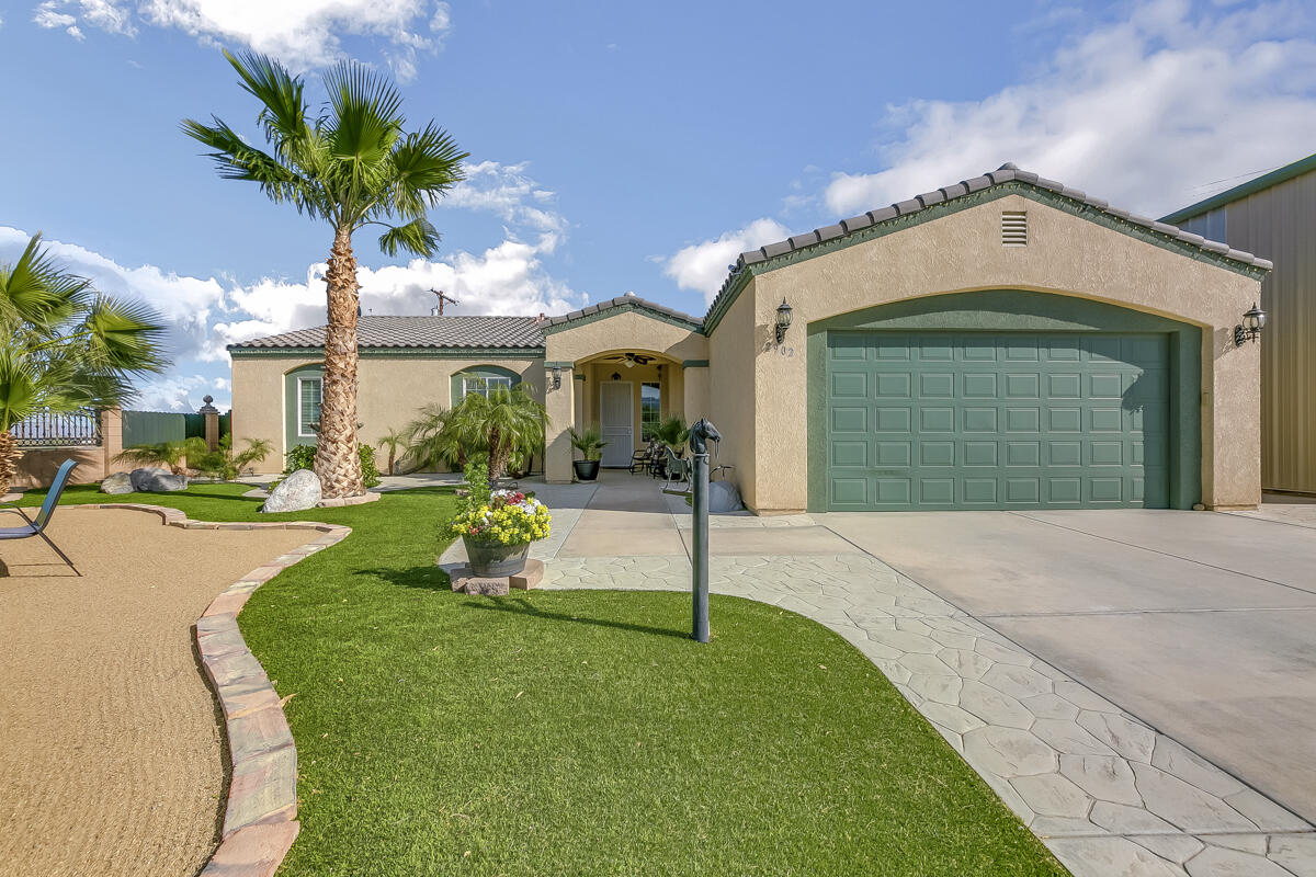 2902 Treadwell Boulevard Thermal, CA 92274 - Photo 35 of 88 a front view of a house with garden