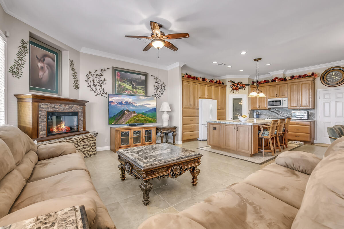 2902 Treadwell Boulevard Thermal, CA 92274 - Photo 40 of 88 a living room with furniture ceiling fan and a fireplace