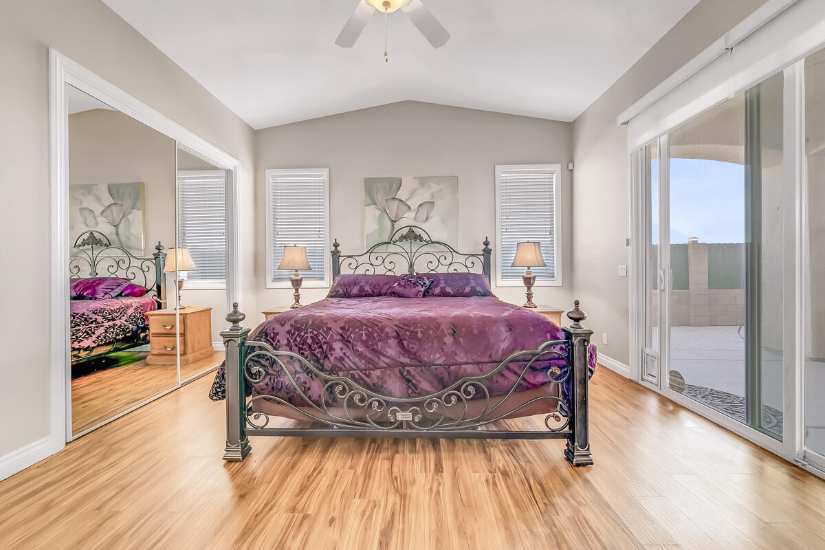 2902 Treadwell Boulevard Thermal, CA 92274 - Photo 54 of 88 a bedroom with a bed and wooden floor