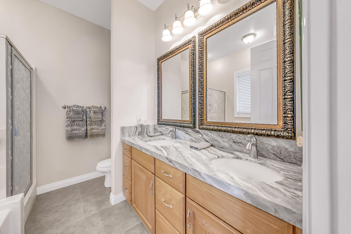 2902 Treadwell Boulevard Thermal, CA 92274 - Photo 56 of 88 a bathroom with a granite countertop sink and a mirror