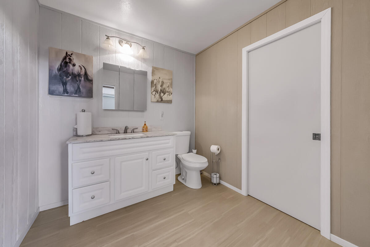 2902 Treadwell Boulevard Thermal, CA 92274 - Photo 69 of 88 a bathroom with a granite countertop toilet sink and mirror