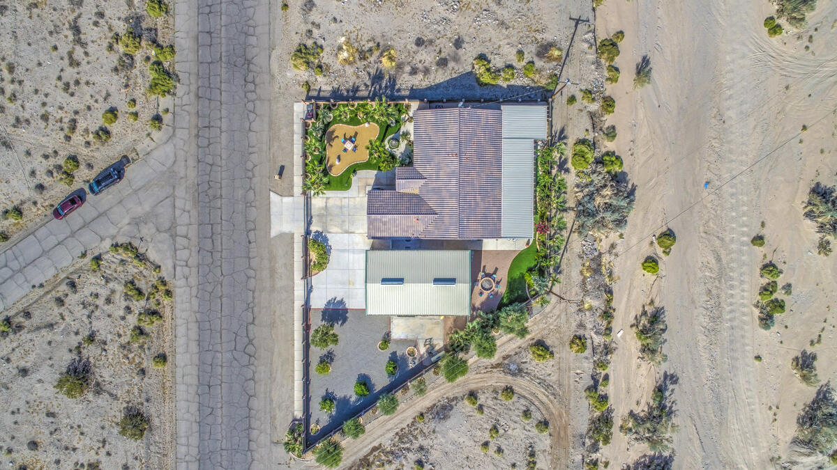 2902 Treadwell Boulevard Thermal, CA 92274 - Photo 77 of 88 an aerial view of a house with a yard and large trees