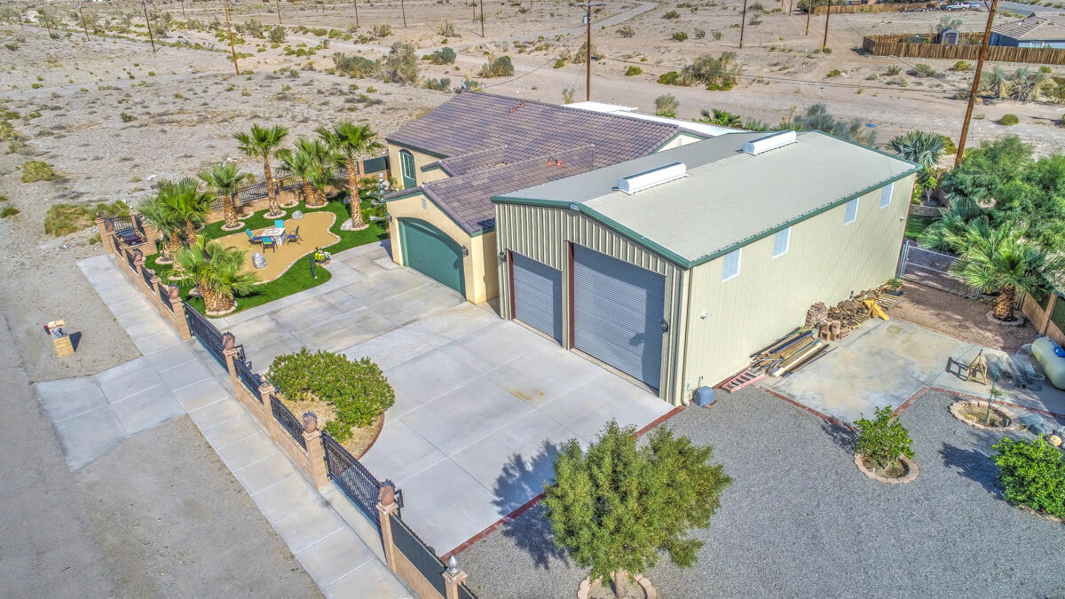 2902 Treadwell Boulevard Thermal, CA 92274 - Photo 79 of 88 an aerial view of a house with a yard and a large tree