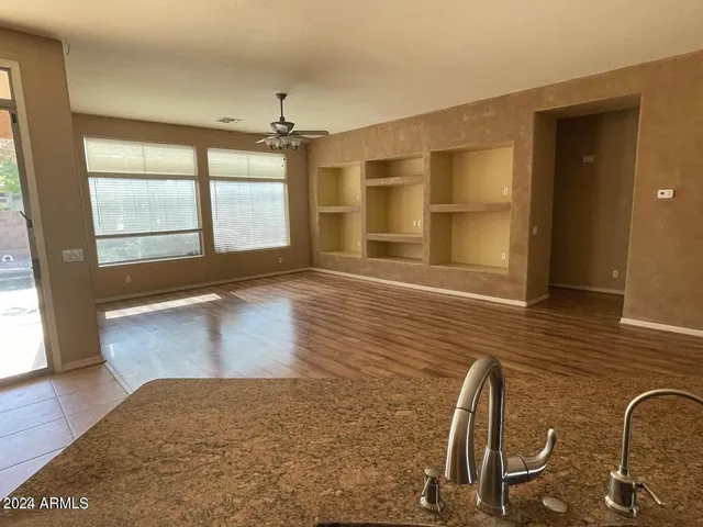 a kitchen with a sink and a window