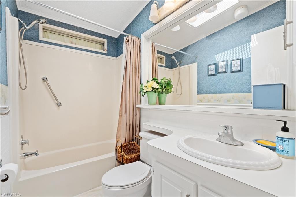 278 Riverwood Road Naples, FL 34114 - Photo 15 of 43 Full bathroom featuring vanity, shower / tub combo, and toilet