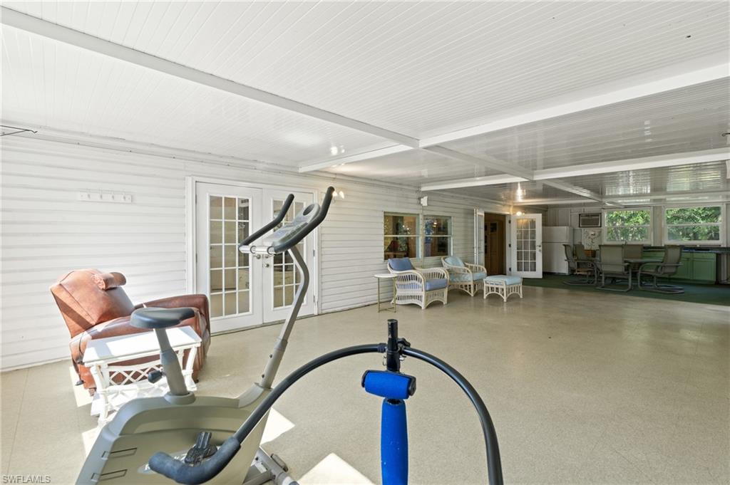 278 Riverwood Road Naples, FL 34114 - Photo 30 of 43 Exercise room featuring french doors