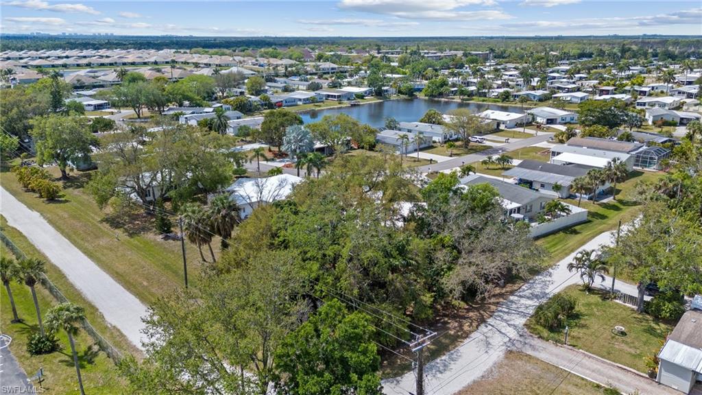 278 Riverwood Road Naples, FL 34114 - Photo 40 of 43 Birds eye view of property featuring a residential view and a water view
